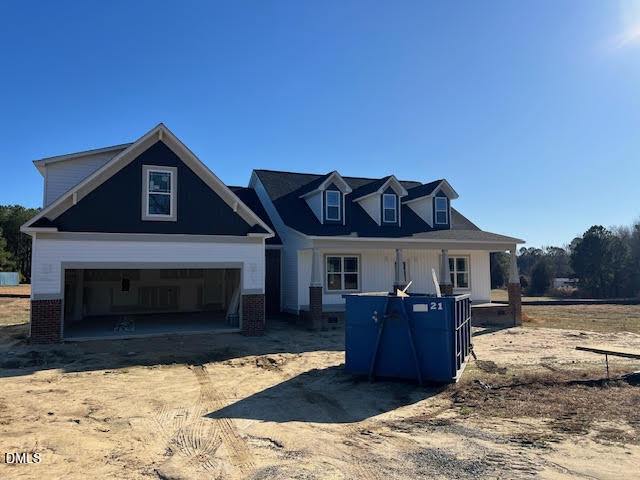 205 Big Pine Road Clayton, NC 27520 - Photo 18 of 22 a view of a livingroom with furniture and a fireplace