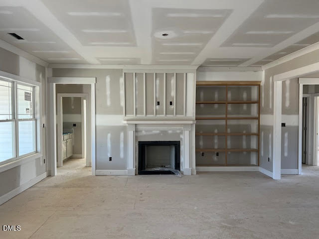 205 Big Pine Road Clayton, NC 27520 - Photo 7 of 22 an empty room with fireplace and windows