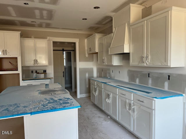 205 Big Pine Road Clayton, NC 27520 - Photo 8 of 22 a kitchen with stainless steel appliances granite countertop a sink and cabinets