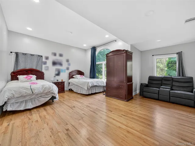 a bedroom with a bed and a couch