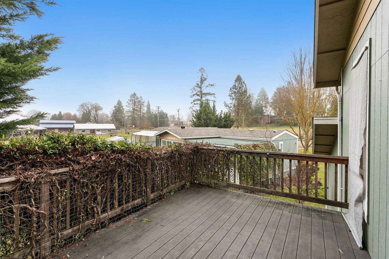 4930 Leonard Road Grants Pass, OR 97527 - Photo 30 of 33 a view of a balcony with wooden floor