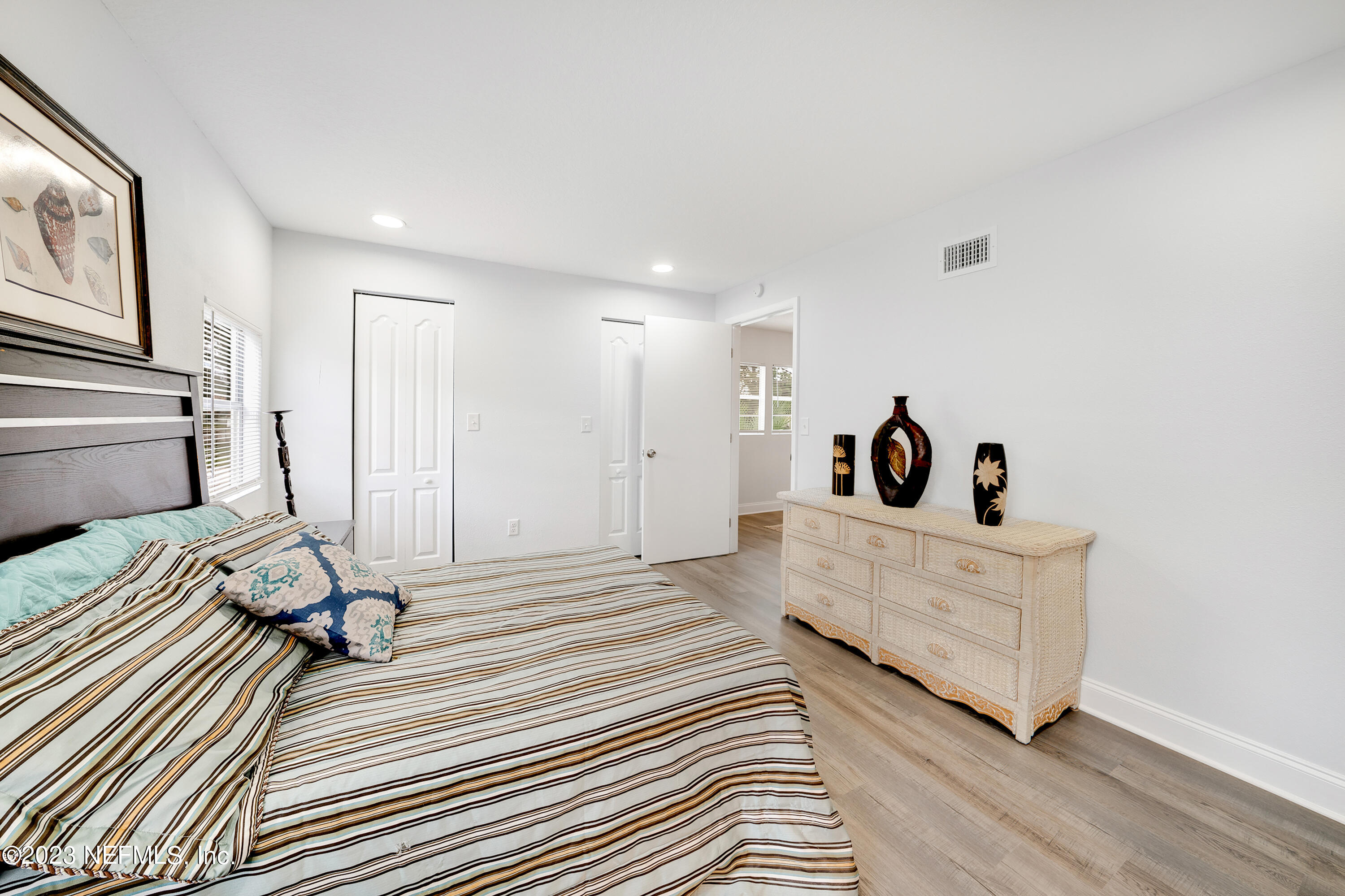 7404 Bamberg Road Jacksonville, FL 32277 - Photo 17 of 31 a view of a room with wooden floor and furniture