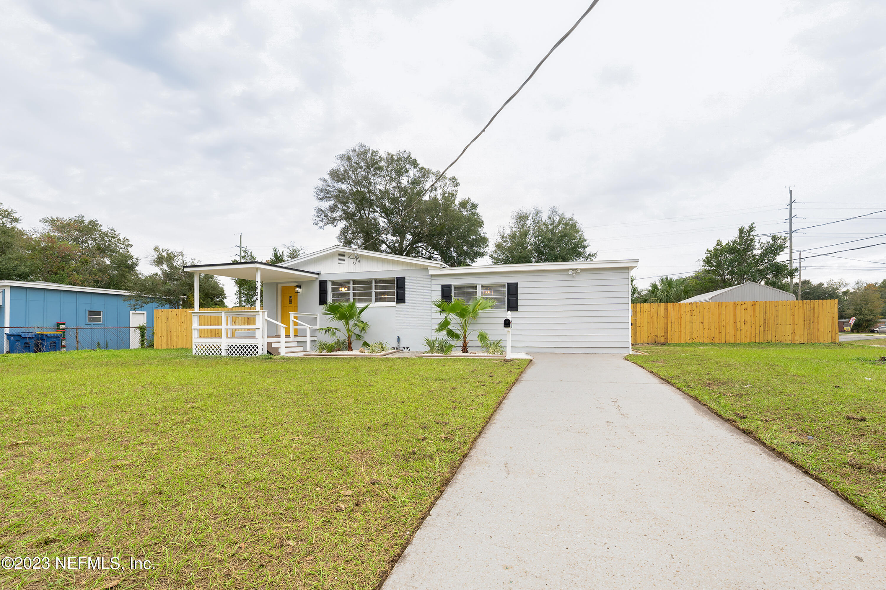 7404 Bamberg Road Jacksonville, FL 32277 - Photo 2 of 31 a front view of house with yard and trees
