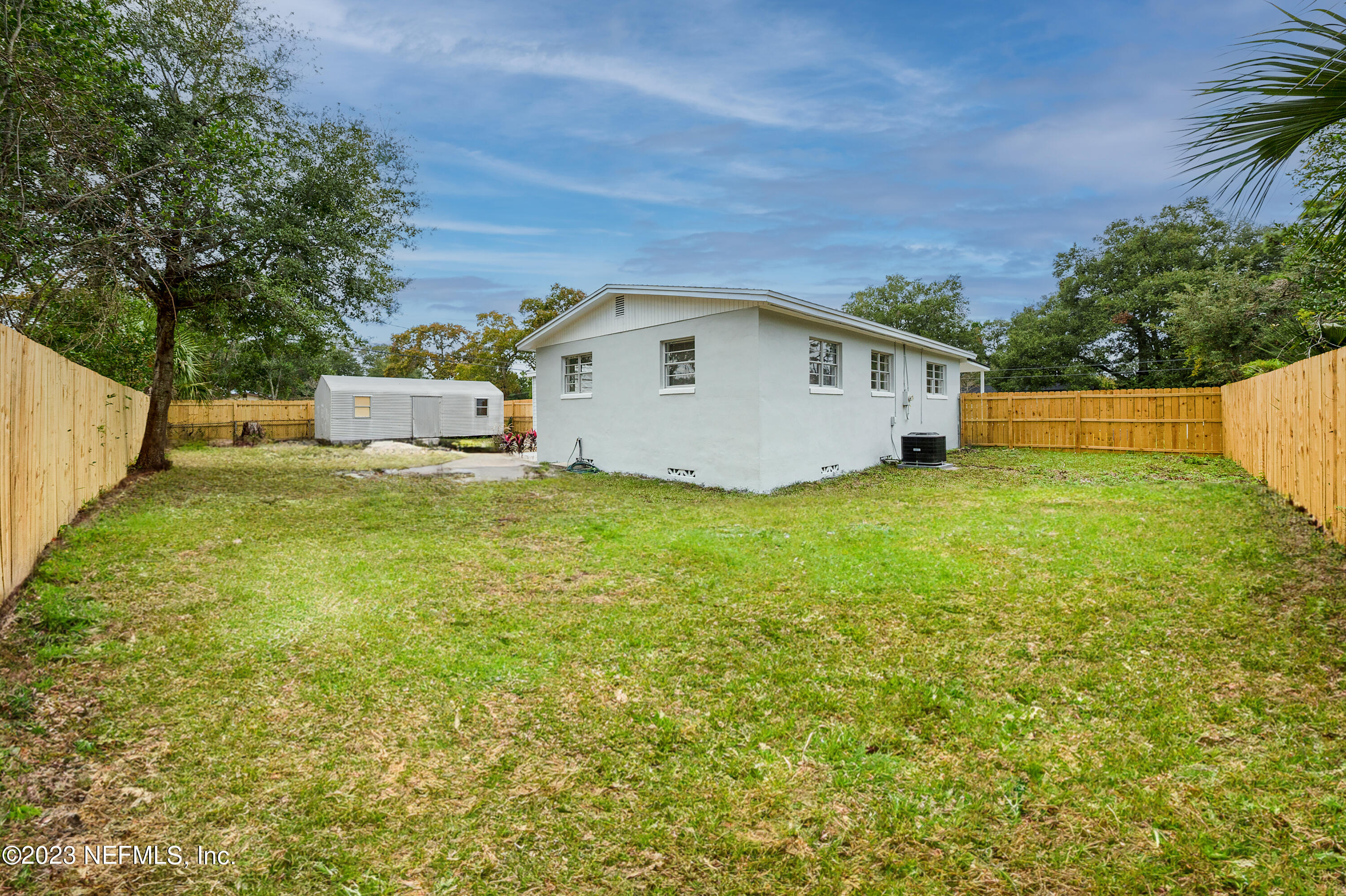 7404 Bamberg Road Jacksonville, FL 32277 - Photo 27 of 31 a view of a house with a yard