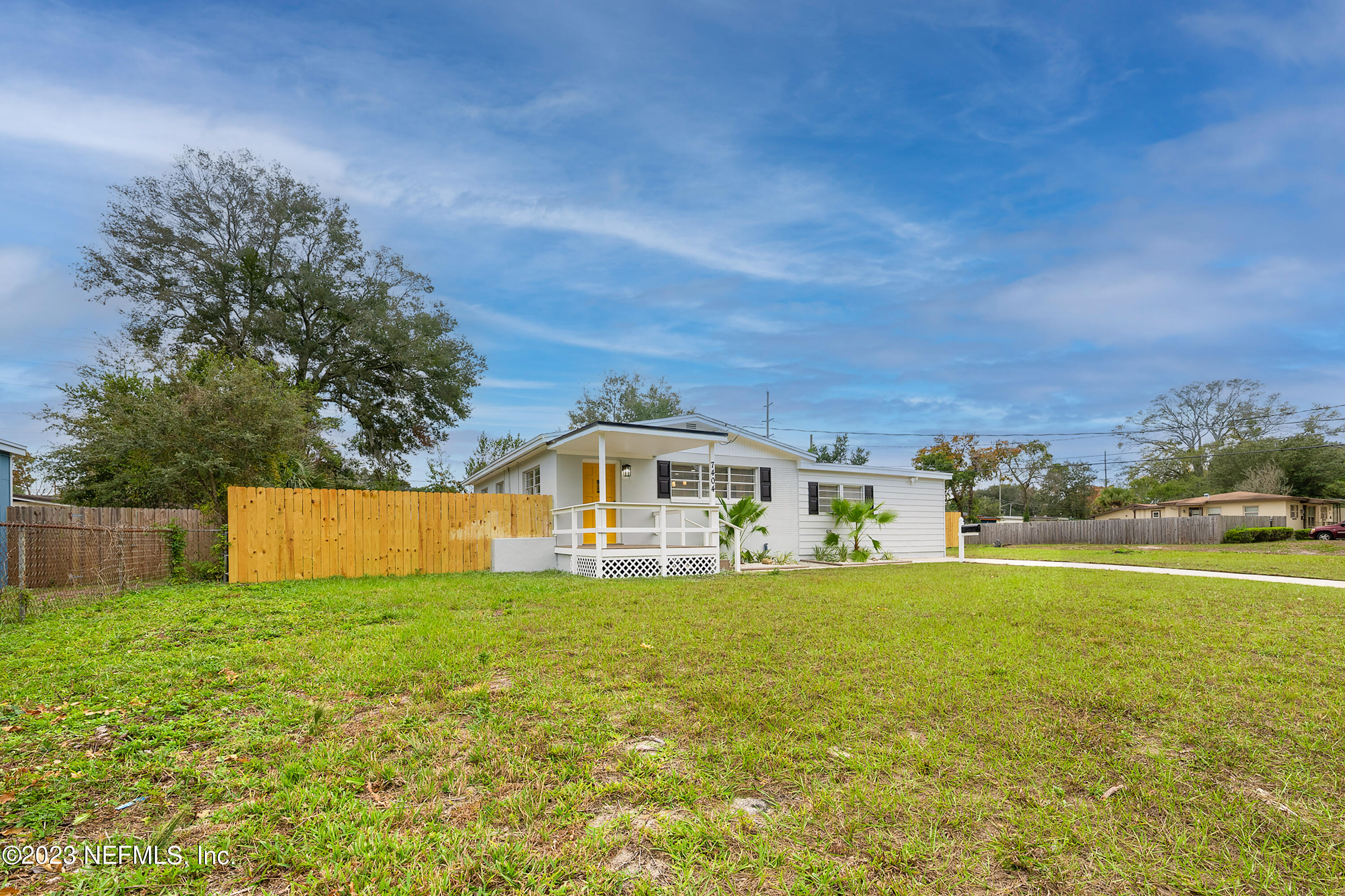 7404 Bamberg Road Jacksonville, FL 32277 - Photo 3 of 31 a view of a house with a big yard