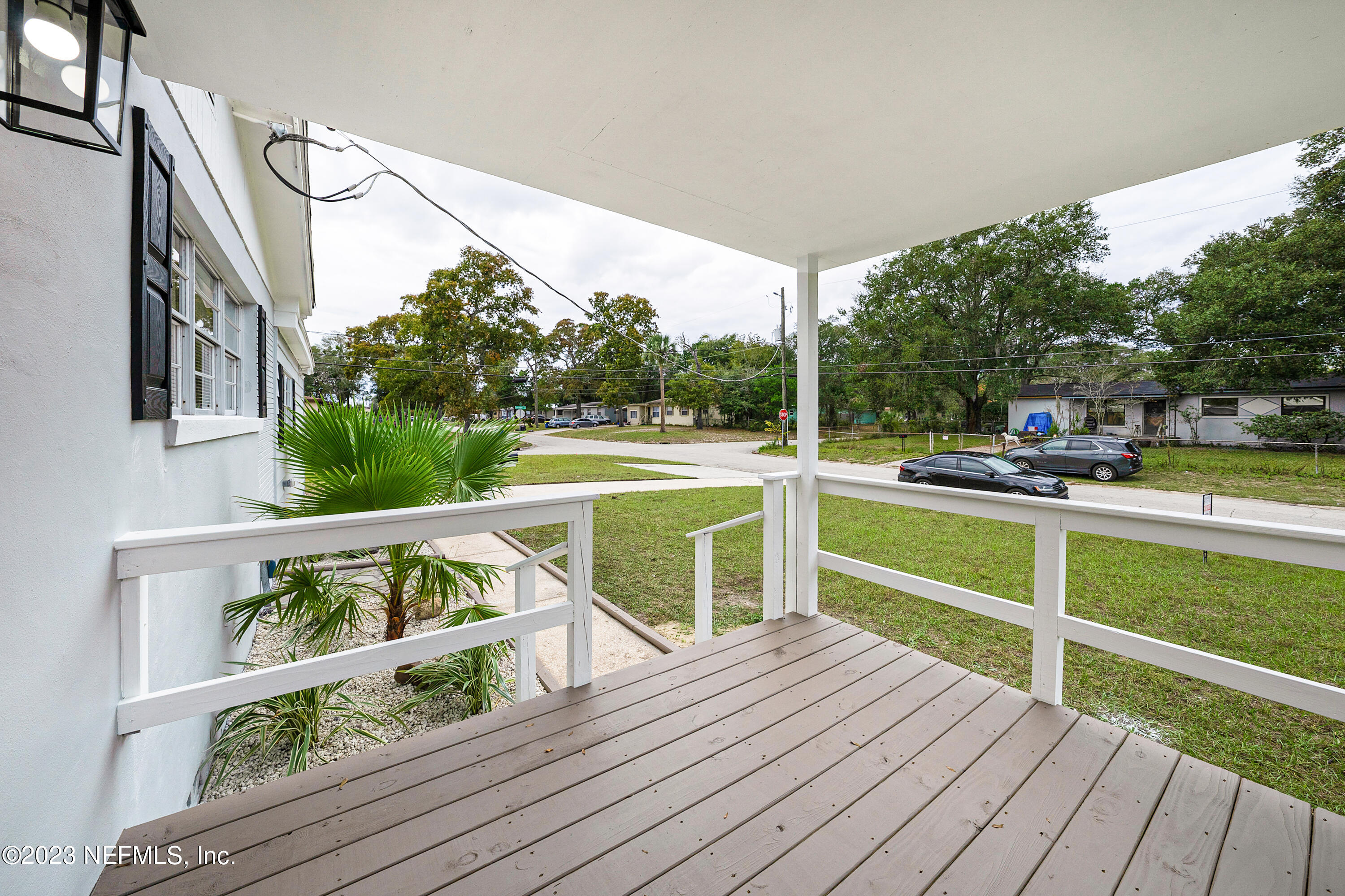 7404 Bamberg Road Jacksonville, FL 32277 - Photo 7 of 31 a view of balcony with wooden floor and seating space