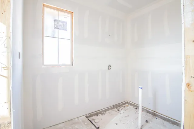 an empty room with windows