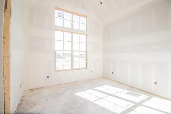 an empty room with windows