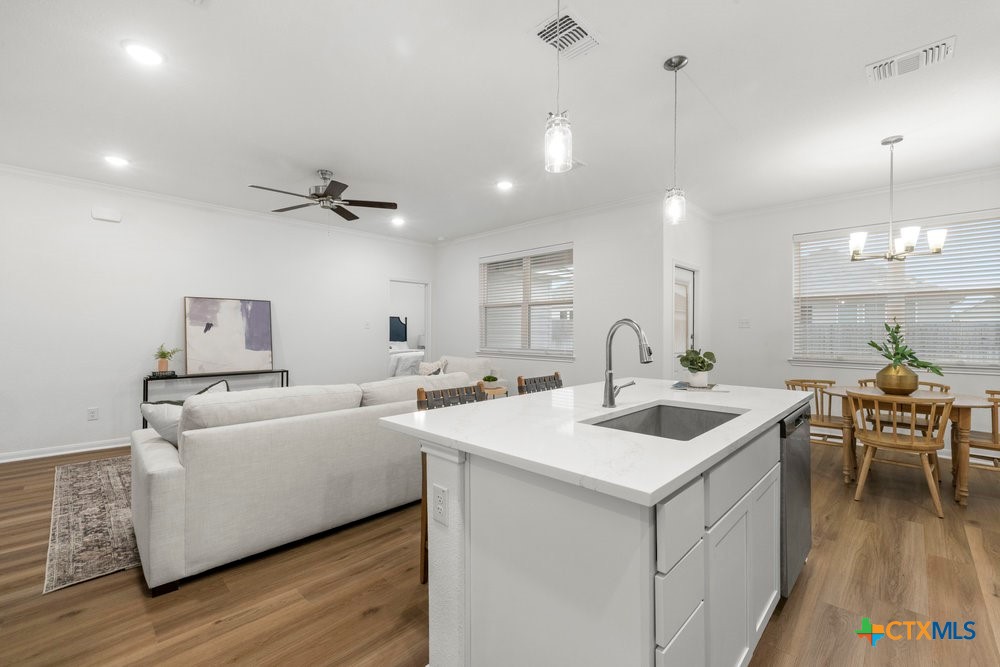 8114 Timber Hollow Lane Temple, TX 76502 - Photo 16 of 34 a living room with furniture a dining table and chairs