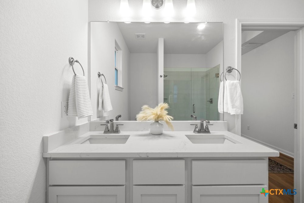 8114 Timber Hollow Lane Temple, TX 76502 - Photo 26 of 34 a bathroom with a sink and a mirror