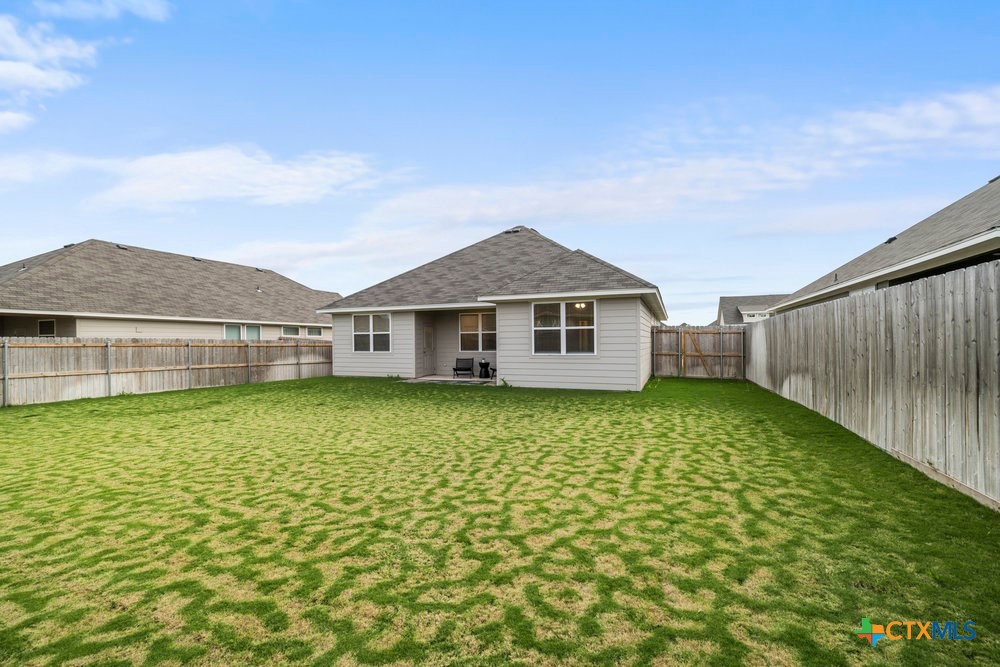 8114 Timber Hollow Lane Temple, TX 76502 - Photo 33 of 34 a view of a yard in front of a house with a large tree