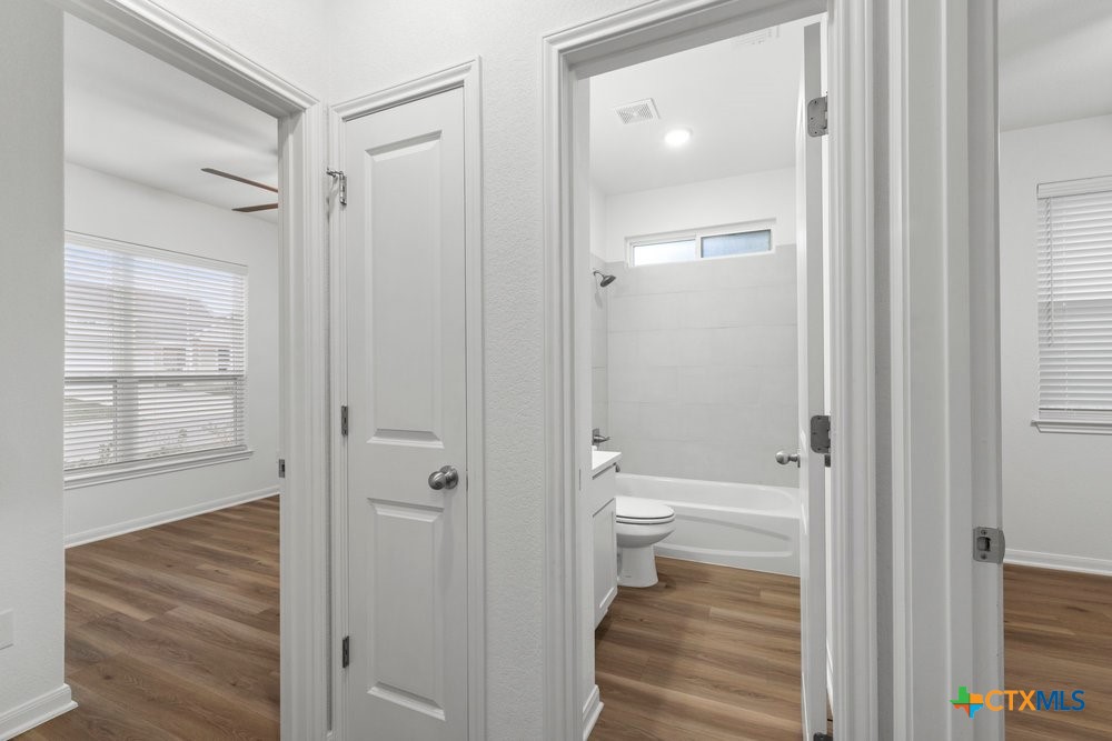 8114 Timber Hollow Lane Temple, TX 76502 - Photo 5 of 34 a bathroom with a toilet and a shower