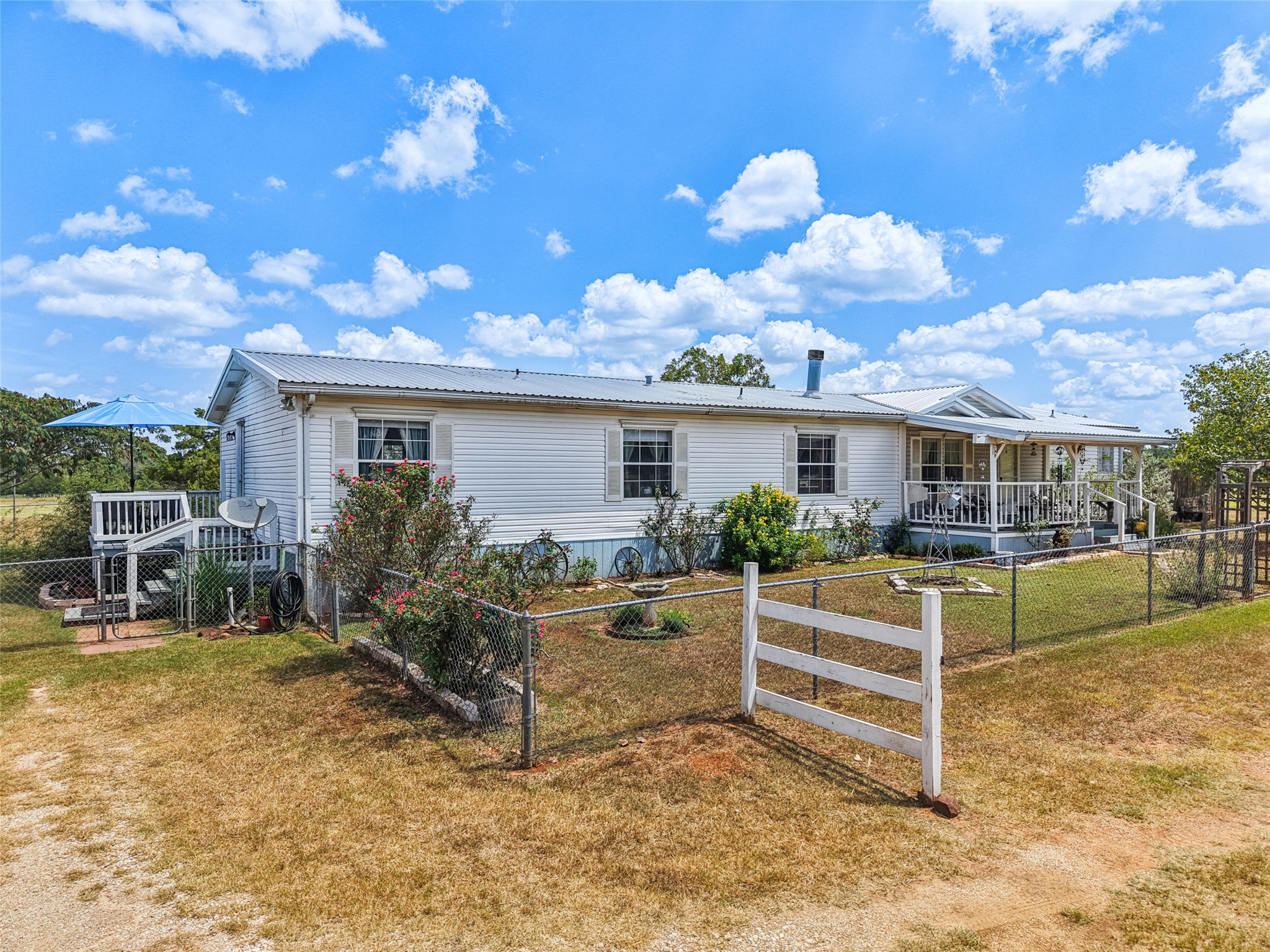 372 Hofferek Road Rosanky, TX 78953 - Photo 37 of 40 a view of a house with backyard and sitting area