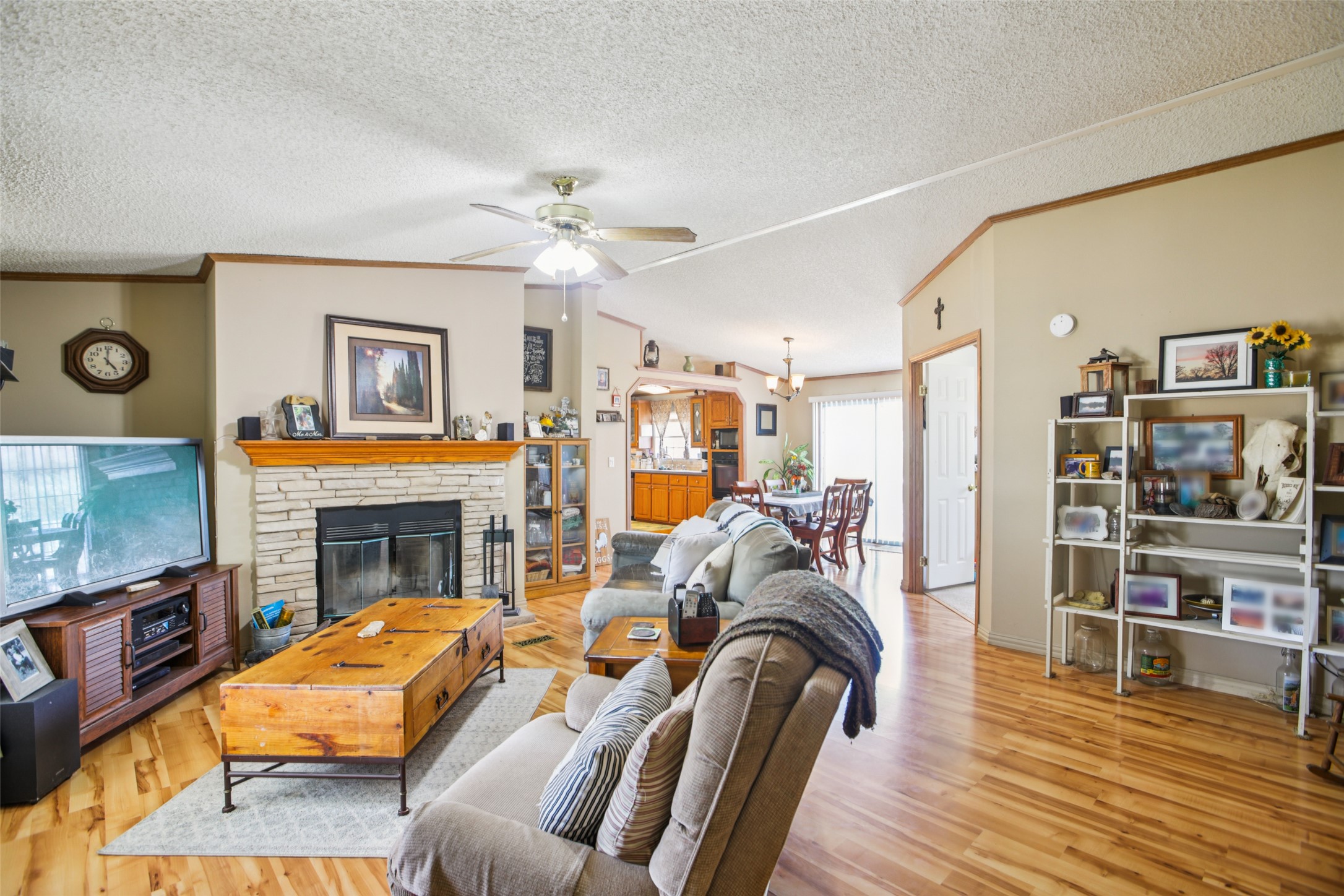 372 Hofferek Road Rosanky, TX 78953 - Photo 7 of 40 a living room with furniture a flat screen tv and a fireplace
