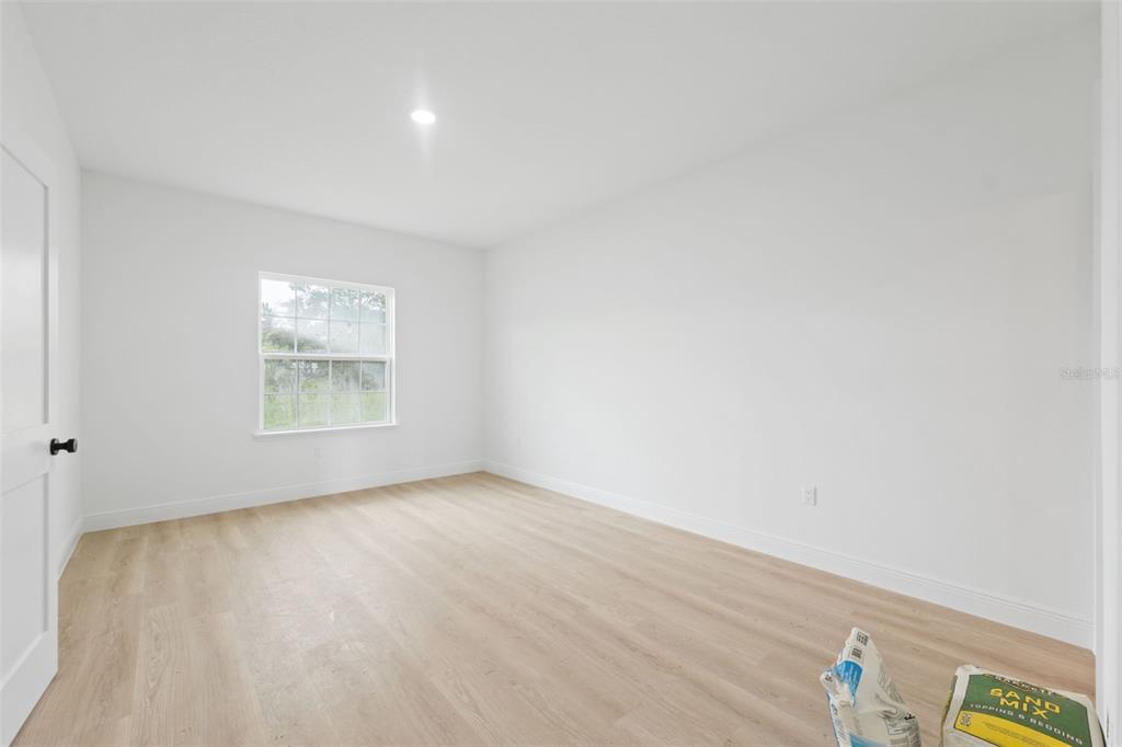 3261 Southwest 129th Loop Ocala, FL 34473 - Photo 17 of 32 an empty room with windows