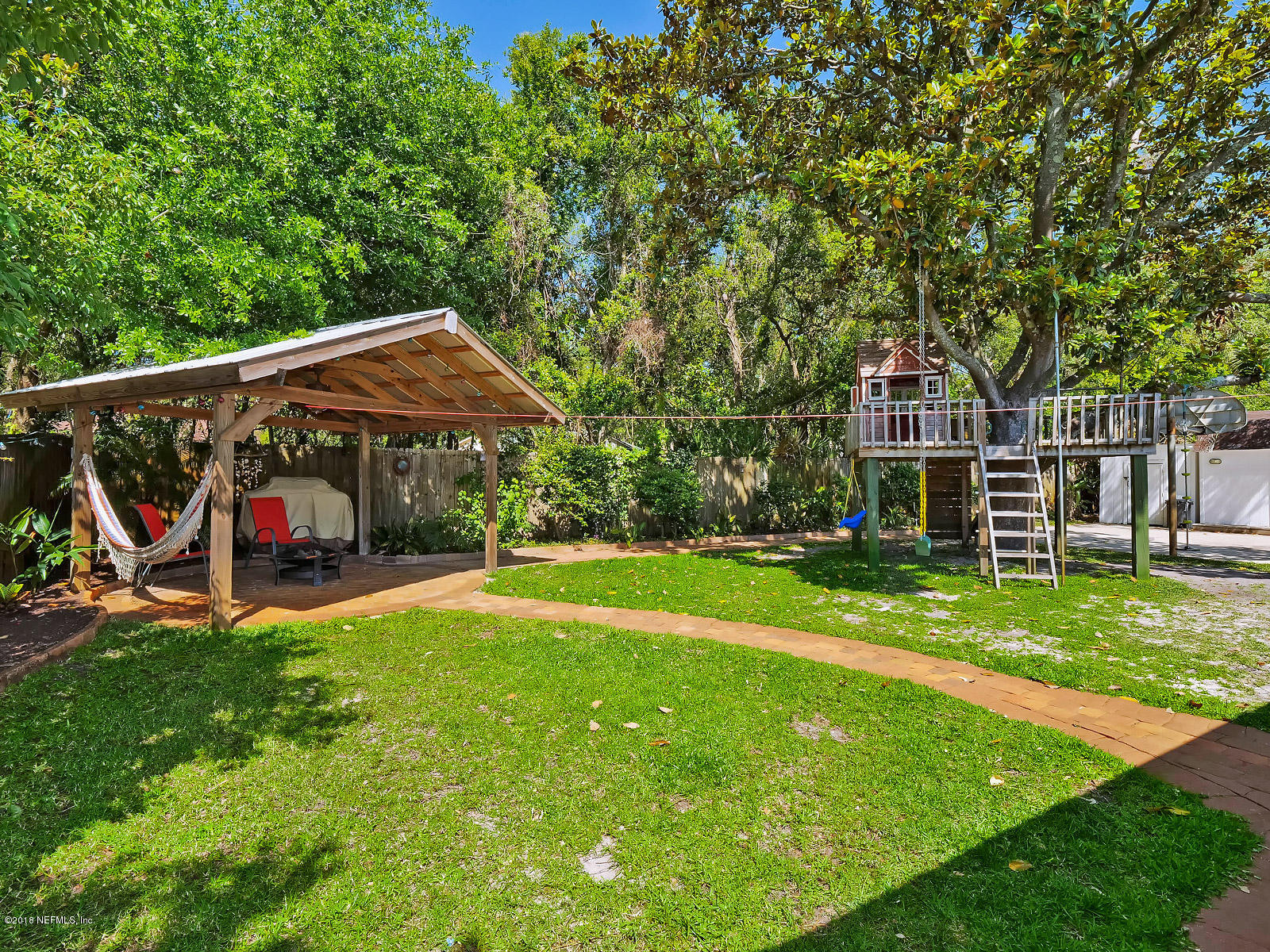 900 Lincoln Road Neptune Beach, FL 32266 - Photo 27 of 46 Backyard with Treehouse