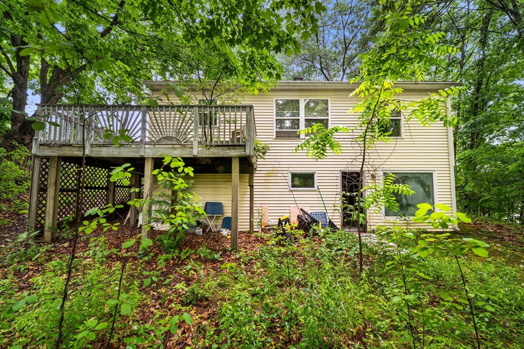 7 Upland Road Natick, MA 01760 - Photo 12 of 15 a front view of a house with garden