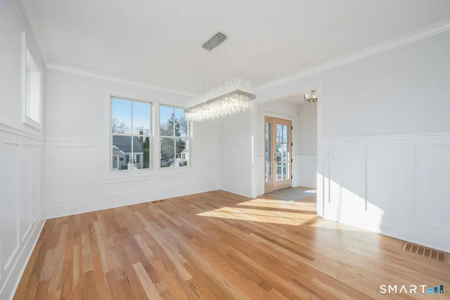 a view of livingroom with hardwood floor and hallway