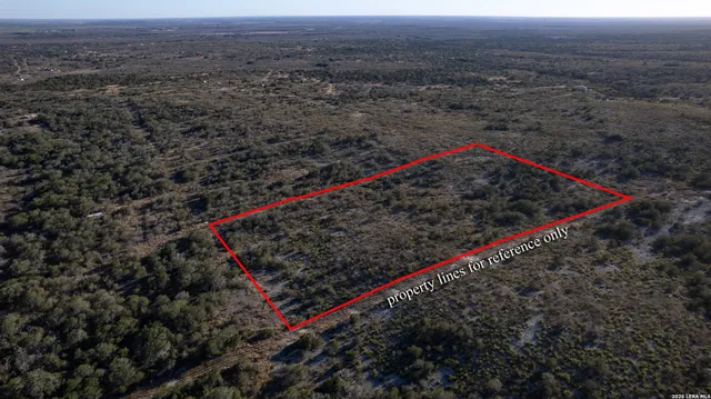 a view of a pathway with a wooden fence