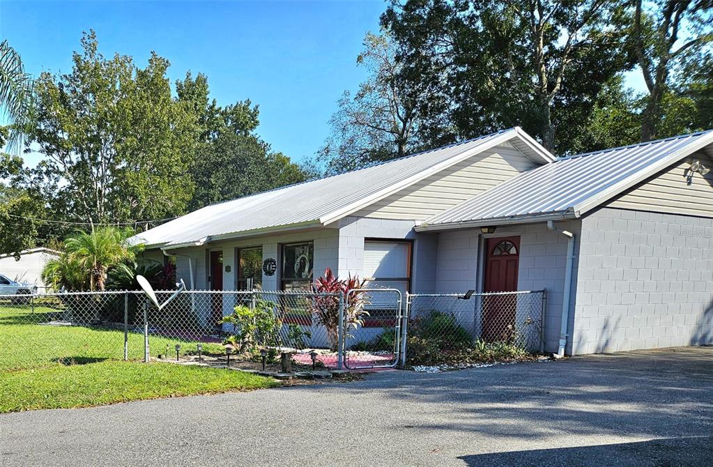 24008 Ermine Road Astor, FL 32102 - Photo 1 of 1 a front view of a house with porch