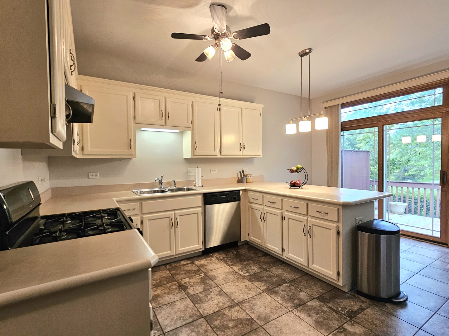 18743 Wren Circle Mokena, IL 60448 - Photo 2 of 25 a kitchen with a sink a stove and chairs