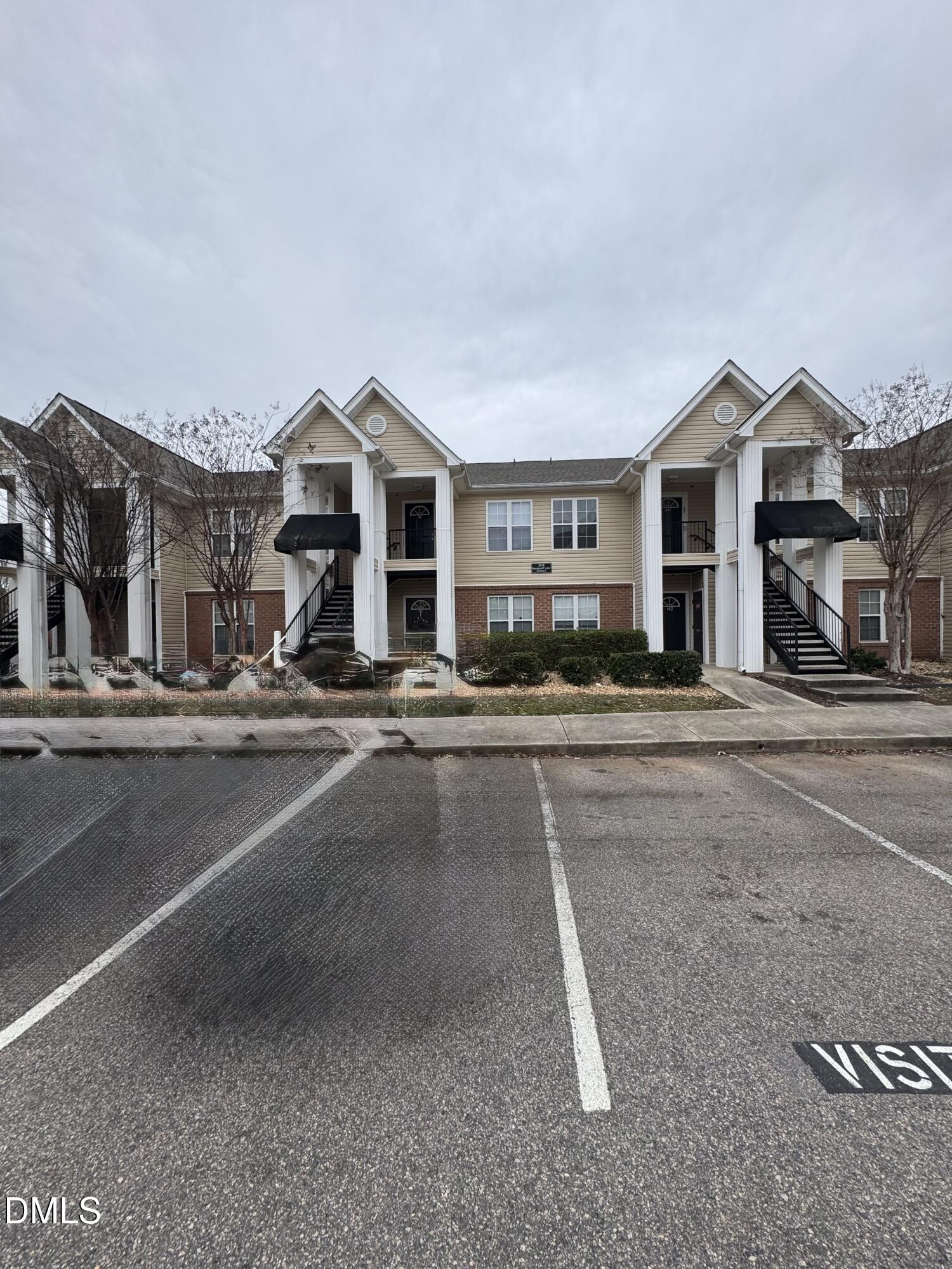a view of a house with a street