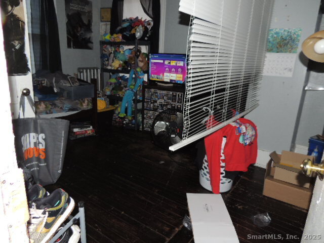 201 Colony Street Meriden, CT 06451 - Photo 16 of 16 a bathroom with a sink a toilet and mirror
