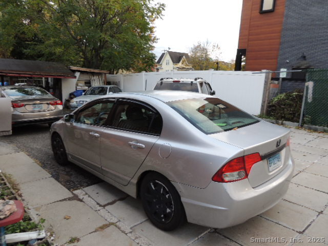 201 Colony Street Meriden, CT 06451 - Photo 3 of 16 a view of cars parked on the street