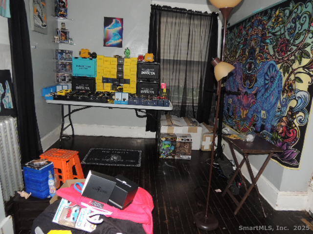 201 Colony Street Meriden, CT 06451 - Photo 5 of 16 a living room with furniture and a fireplace