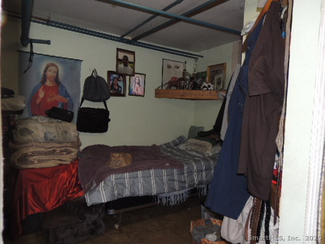 201 Colony Street Meriden, CT 06451 - Photo 9 of 16 a bedroom with a bed and closet