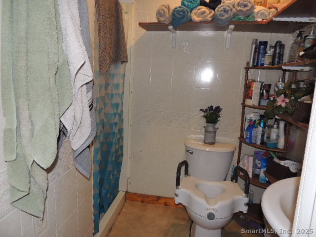 201 Colony Street Meriden, CT 06451 - Photo 10 of 16 a bathroom with a toilet and a sink
