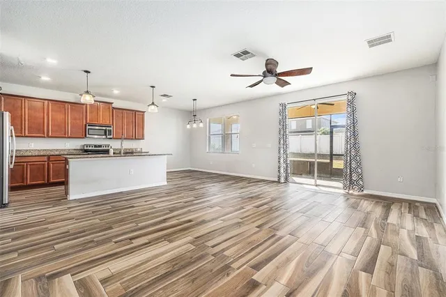 a view of kitchen with wooden floor and window