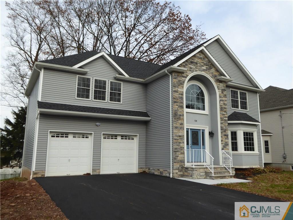 128 Normandy Road Colonia, NJ 07067 - Photo 40 of 41 a front view of a house with a yard