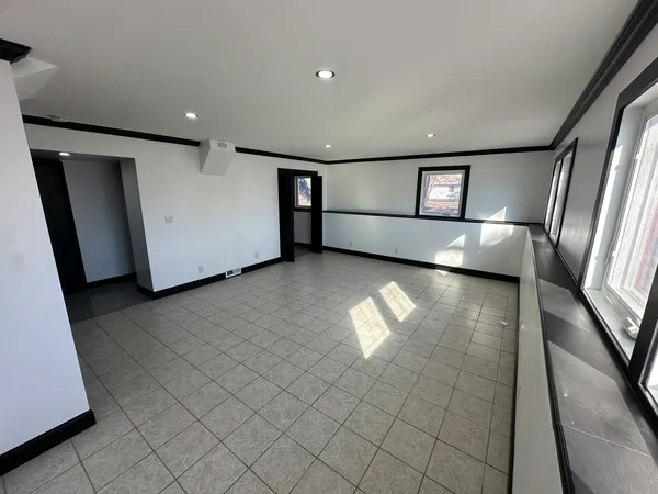 a view of a livingroom with furniture and window