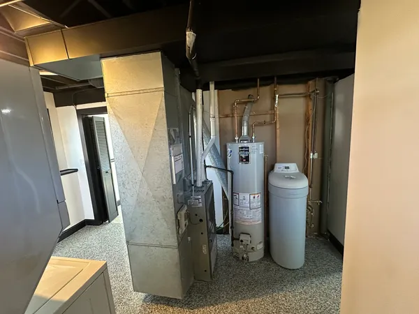 a view of a storage & utility room with closet