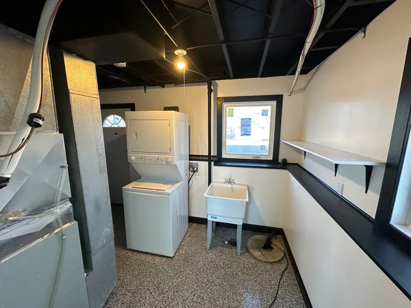a bathroom with a toilet a sink and a bathtub