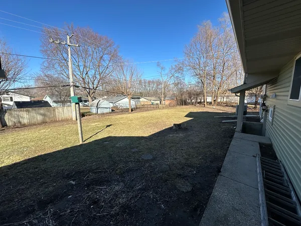a view of a backyard of the house