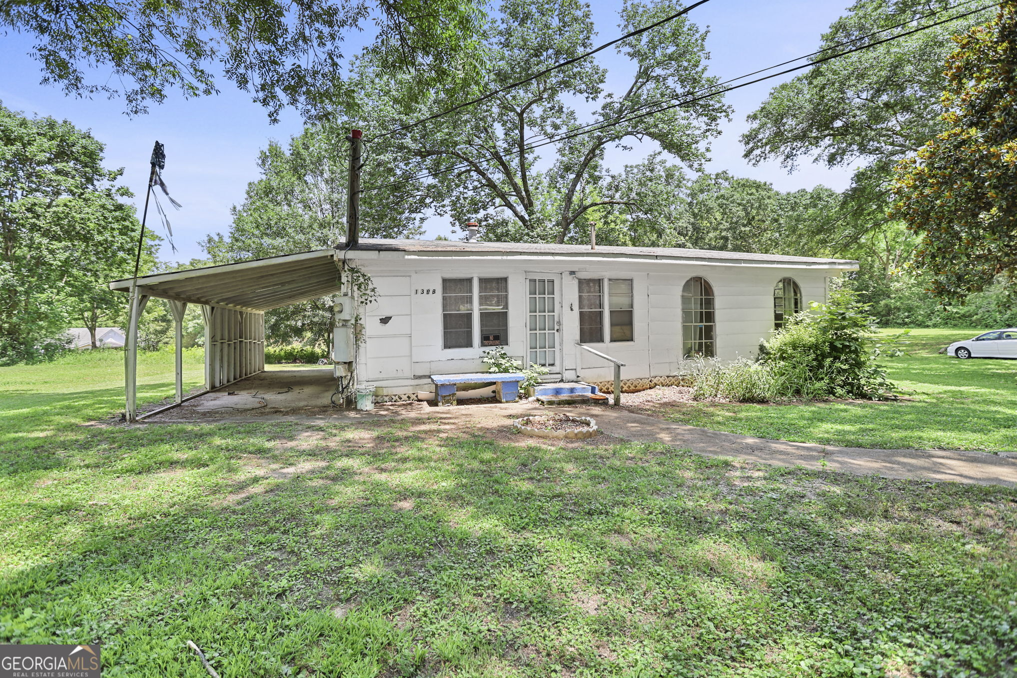 138 Main Street Sharpsburg, GA 30277 - Photo 16 of 34 a view of a house with backyard and sitting area