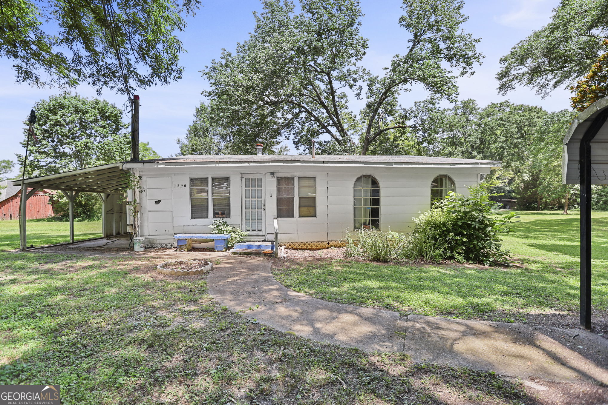 138 Main Street Sharpsburg, GA 30277 - Photo 2 of 34 front view of a house with a yard