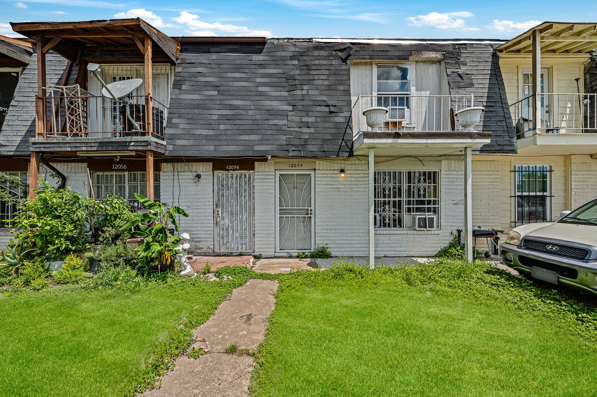 12054 Beechnut Street Houston, TX 77072 - Photo 15 of 21 a view of a house with a yard and sitting chair