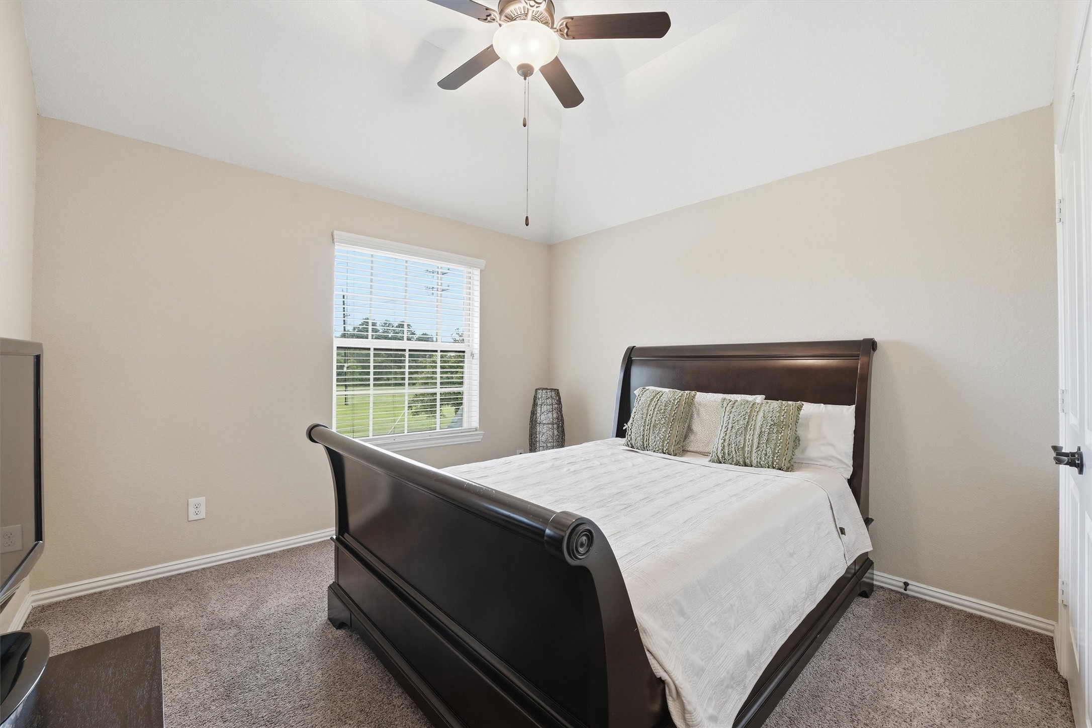 12506 Northpointe Ridge Lane Tomball, TX 77377 - Photo 21 of 31 a bedroom with a bed and a window