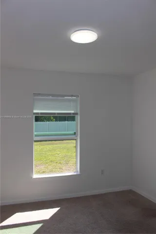 an empty room with closet area
