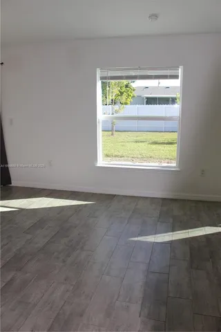 a kitchen with a stove and a chandelier