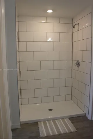 a bathroom with a double vanity sink and mirror