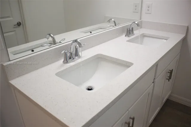 a bathroom with a sink toilet and vanity