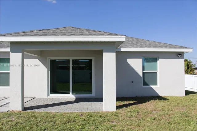 a view of backyard with outdoor seating