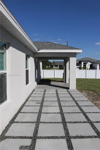 a view of a backyard of the house