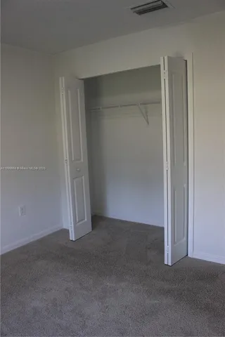 a bathroom with a sink toilet and mirror