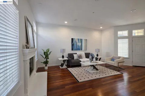 a living room with furniture rug and window