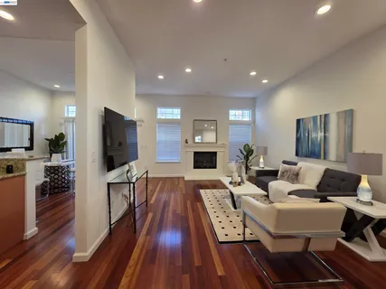 a living room with fireplace furniture and a flat screen tv